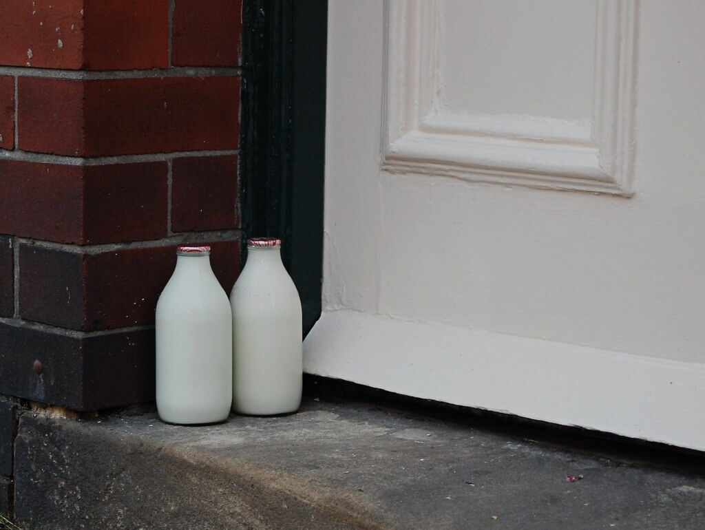 milk bottles on a doorstep delivered by the milkman