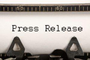 press release being created on a typewriter